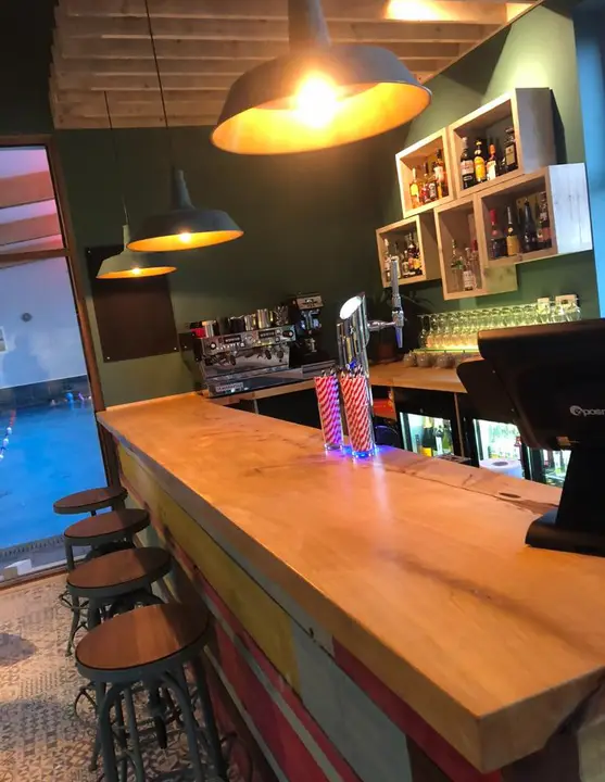 Industrial pendant lighting and bar electrics in a café