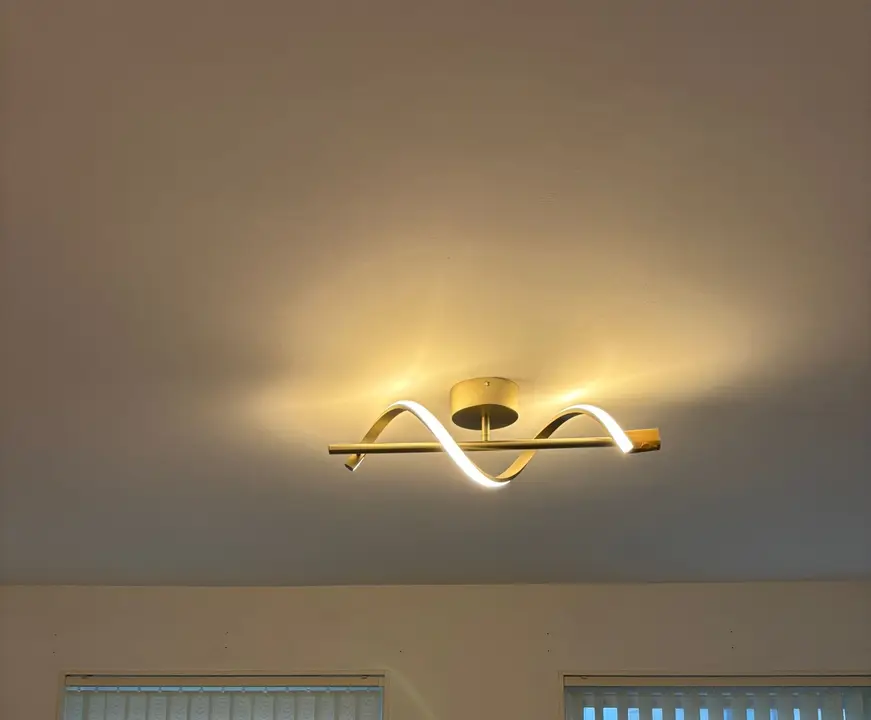 Modern LED wave ceiling light installed in a living room
