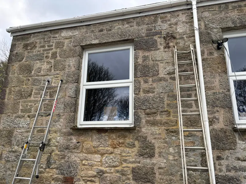 Granite cottage wall before outdoor lights were installed